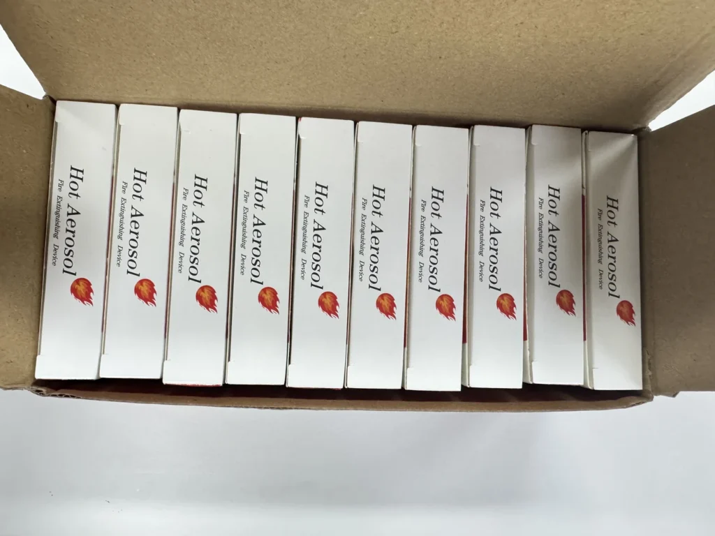 Individually boxed aerosol devices packed inside an open shipping carton